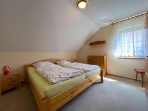 Katil atau katil-katil dalam bilik di Ferienwohnung Waldesrand