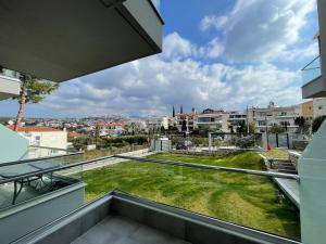 an open balcony with a view of a yard at Panorama Sunvilles Apartment 3 in Thessaloniki