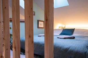 Postel nebo postele na pokoji v ubytování Tiny house Les Nomades