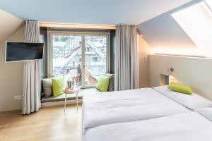Voodi või voodid majutusasutuse Hotel Dom - das Hotel mit dem Integrationskonzept toas