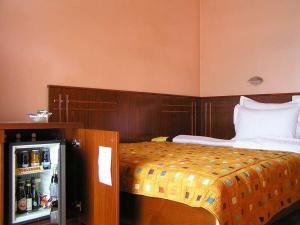 Letto o letti in una camera di Hotel Royal
