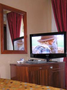TV o dispositivi per l'intrattenimento presso Hotel Royal