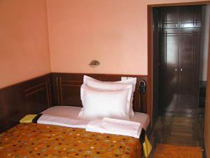 Letto o letti in una camera di Hotel Royal