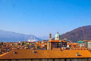 a view of a city with mountains in the background at L’Attico di Susanna in Verbania