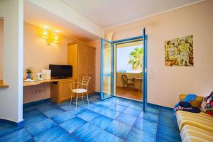 TV a/nebo společenská místnost v ubytování Hotel Ipomea Club