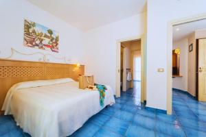 Postel nebo postele na pokoji v ubytování Hotel Ipomea Club