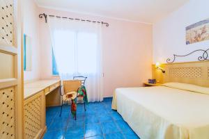 Postel nebo postele na pokoji v ubytování Hotel Ipomea Club