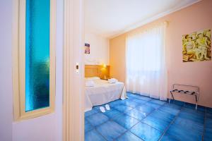 Postel nebo postele na pokoji v ubytování Hotel Ipomea Club
