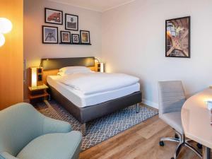 Postel nebo postele na pokoji v ubytování Mercure Hotel Bochum City