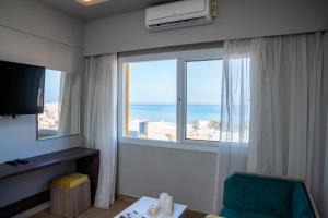 TV a/nebo společenská místnost v ubytování Al Dora Boutique hotel