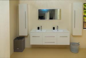 a bathroom with two sinks and a mirror at Ti Anglete Villa in Soufrière +43 photos