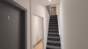 a staircase in a room with a stair case at Double-Bedroom in the Heart of Eccles Manchester Perfect for Short Stays BH4 in Manchester