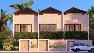 a house with a car parked in front of it at AZORA VILLAS - Bali Invest Club in Tumbak Bayuh