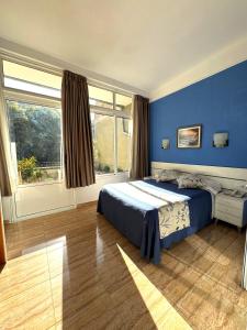 Postel nebo postele na pokoji v ubytování Hostal Ramos