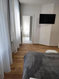 Μια τηλεόραση ή/και κέντρο ψυχαγωγίας στο Apartments33Milan