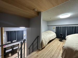 Voodi või voodid majutusasutuse AMShiragishi 201 toas