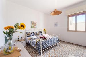 En eller flere senge i et værelse på Villa Heart Island Vista Mare