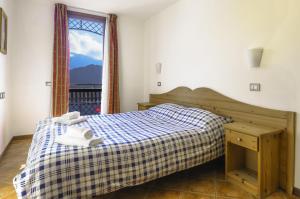 A bed or beds in a room at Borgo Stalle Residence