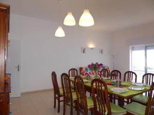 a dining room with a table and chairs at Vital by Check-in Portugal in Albufeira