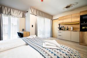 Postel nebo postele na pokoji v ubytování Optimus Residence