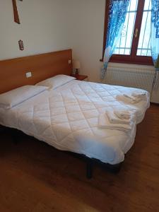 Postel nebo postele na pokoji v ubytování La polse di San Pieri