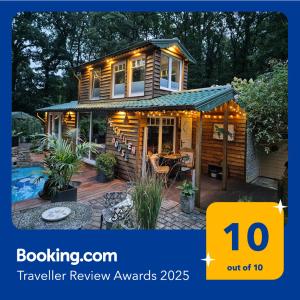 a tiny house with lights on the front of it at Seychellen House in Großenkneten