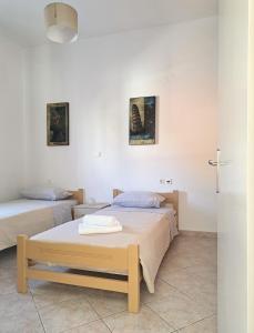 Postel nebo postele na pokoji v ubytování Guest House Alepou Leros