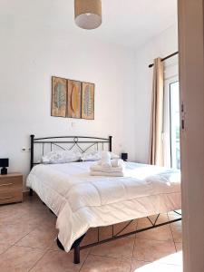 Postel nebo postele na pokoji v ubytování Guest House Alepou Leros