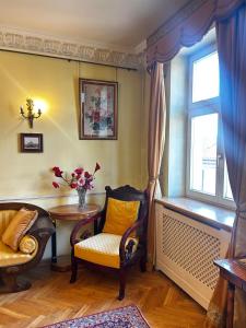a room with a table and chairs and a window at Royal in Kraków