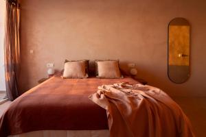 a bedroom with a large bed with a large mirror at Formentera Especial in La Savina