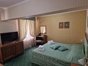 Postel nebo postele na pokoji v ubytování Danube Hotel & Spa