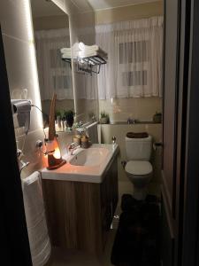 a bathroom with a sink and a toilet and a mirror at Unique villa in madinaty in Madinaty +30 photos