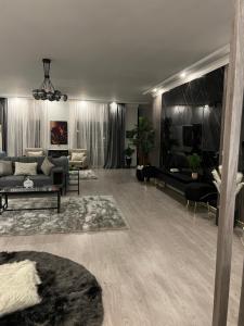 a large living room with couches and a couch at Unique villa in madinaty in Madinaty
