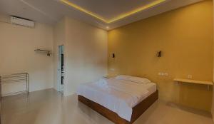 Voodi või voodid majutusasutuse Tangkoko Hideaway Cottage toas