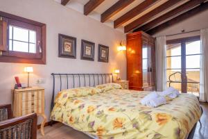 a bedroom with a bed with towels on it at Sa Xigala in Algaida +40 photos