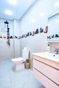 a bathroom with a toilet and a sink at Migdal Calavon in Marrakech