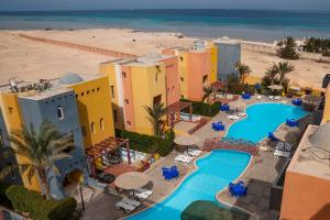 an aerial view of a resort with a pool and the beach at Al-Dora Resort Hurghada in Hurghada