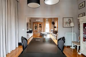 a living room with a large rug on the floor at Vatican Penthouse - Terrace with view in Rome