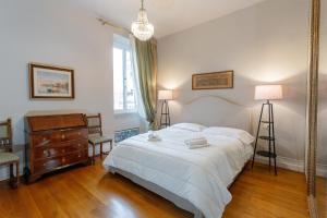 a bedroom with a bed and a dresser and a mirror at Vatican Penthouse - Terrace with view in Rome