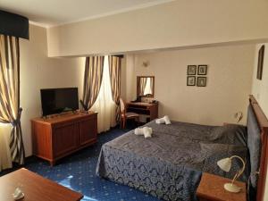 Postel nebo postele na pokoji v ubytování Danube Hotel & Spa