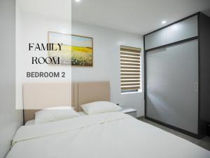 Ένα ή περισσότερα κρεβάτια σε δωμάτιο στο Olive Apartment Hotel Lào Cai
