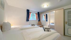 Postel nebo postele na pokoji v ubytování C-Haus Cordula, App 36