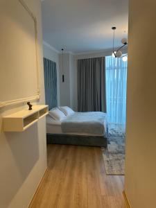 Postel nebo postele na pokoji v ubytování Sky Hotel Korce