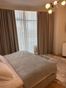 Postel nebo postele na pokoji v ubytování Sky Hotel Korce