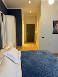 Postel nebo postele na pokoji v ubytování Sky Hotel Korce
