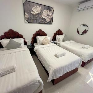 Ένα ή περισσότερα κρεβάτια σε δωμάτιο στο Trio Sea View شقة تريو البحرية