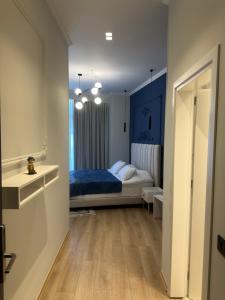 Postel nebo postele na pokoji v ubytování Sky Hotel Korce