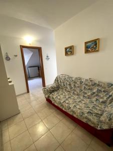 Postel nebo postele na pokoji v ubytování Attico Amelia Soverato Con Terrazzo e Barbecue