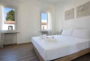 Posteľ alebo postele v izbe v ubytovaní Welc-ōm Santa Giustina apartment