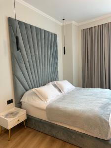 Postel nebo postele na pokoji v ubytování Sky Hotel Korce